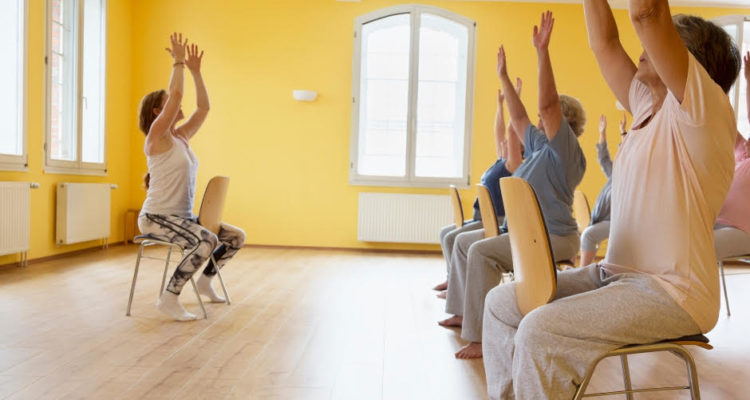 Group practising seated yoga