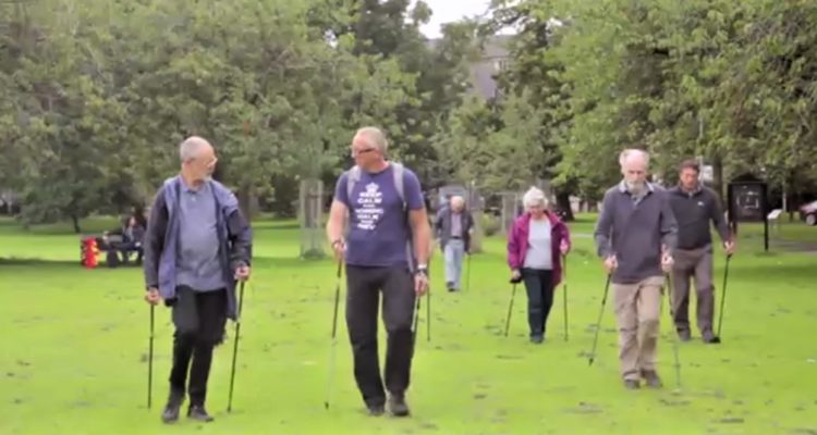 nordic walking group out in the meadows