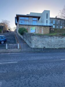 The image shows a building where the walk starts.